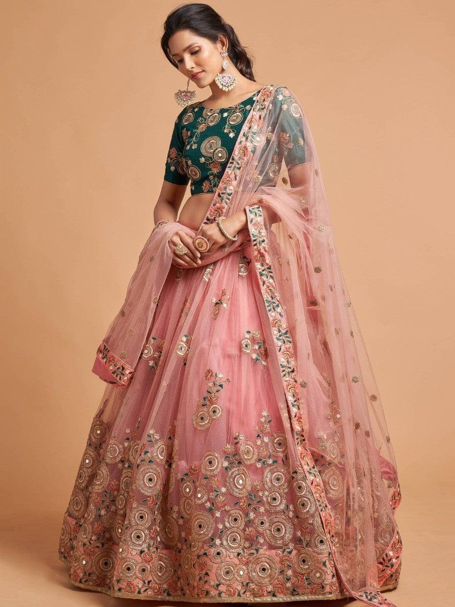 Elegant peach net lehenga with embroidery and sequins.