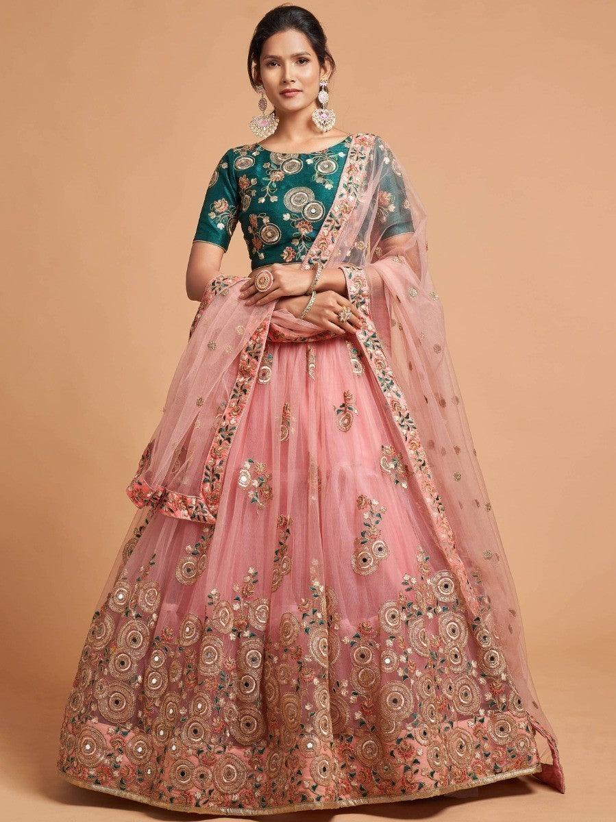 Peach lehenga with green art silk choli and thread work.