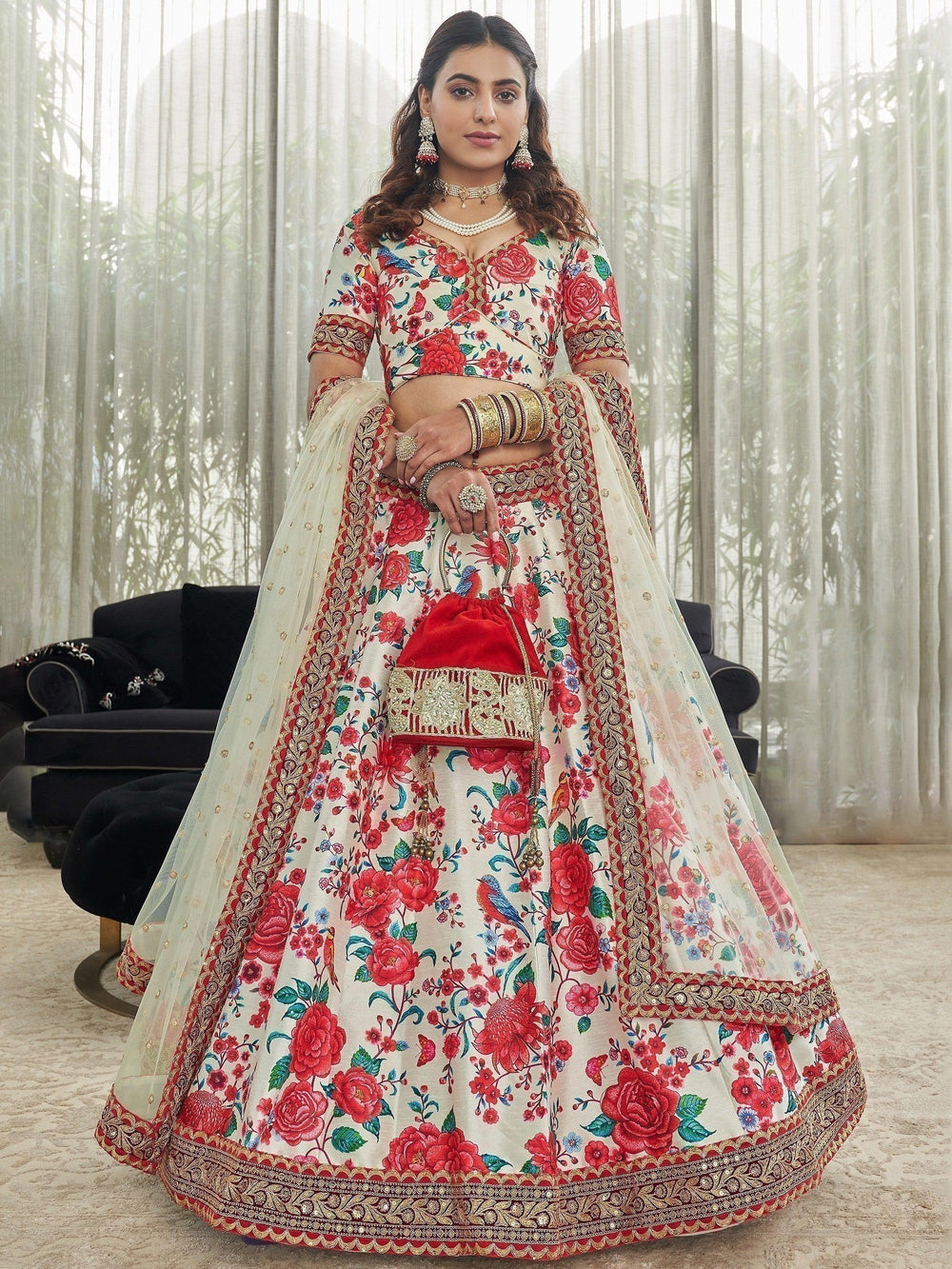 Designer off-white lehenga choli with sequins and embroidered lace border.