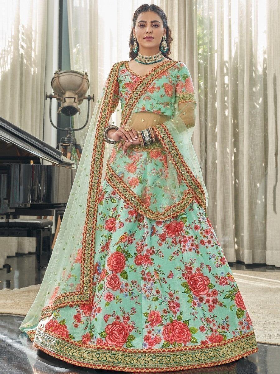 Designer mint green lehenga choli with embroidered lace border and sequins.