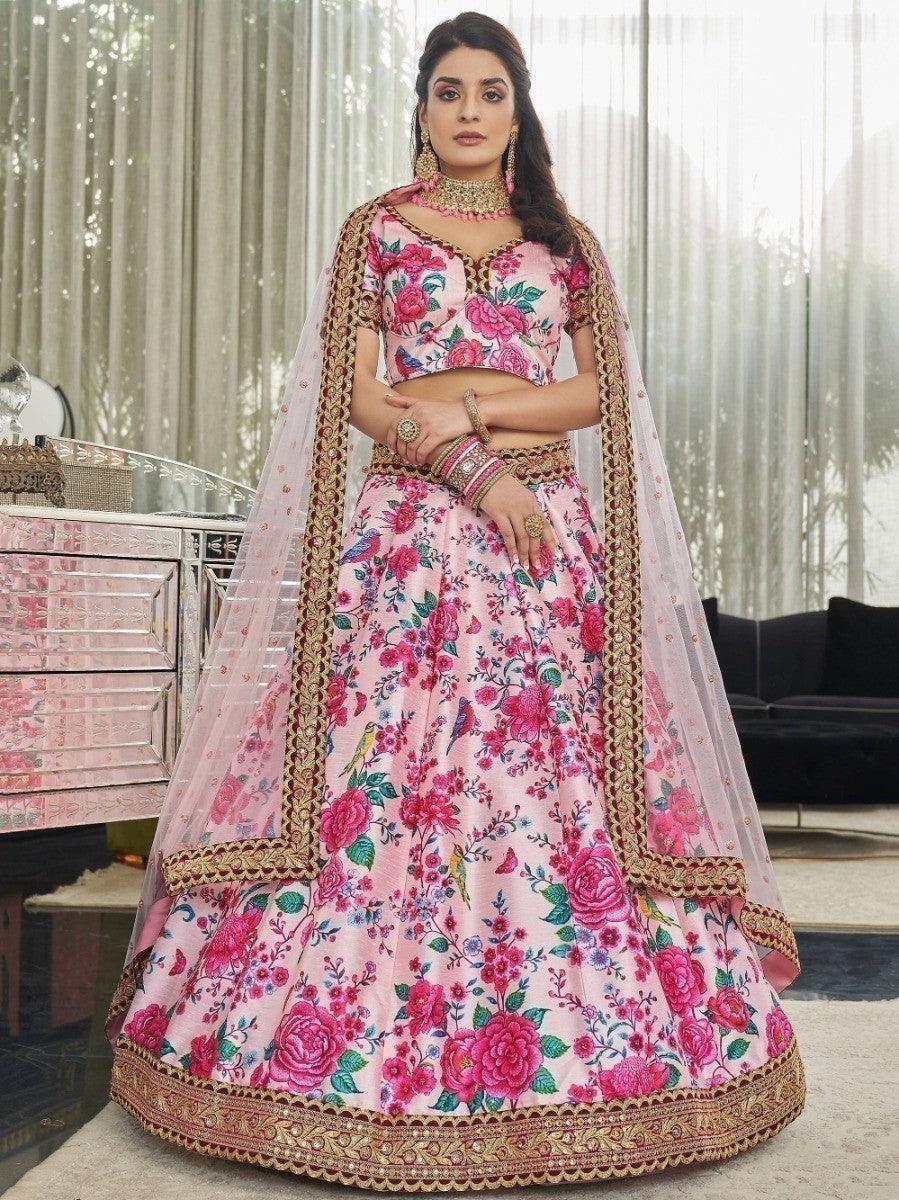 Elegant light pink lehenga with floral print, stonework, and sequins for weddings and parties.