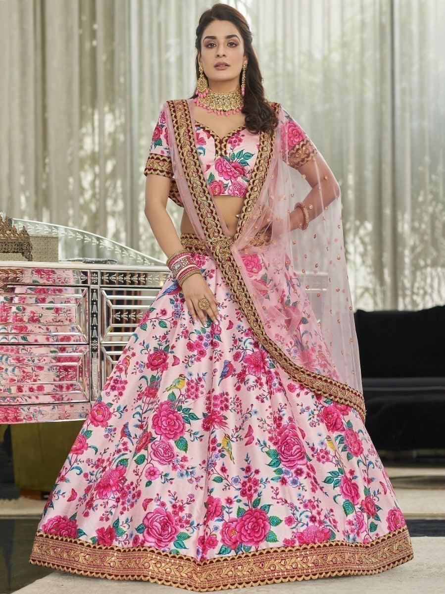 Traditional lehenga choli in light pink with embroidered lace border and dori work.