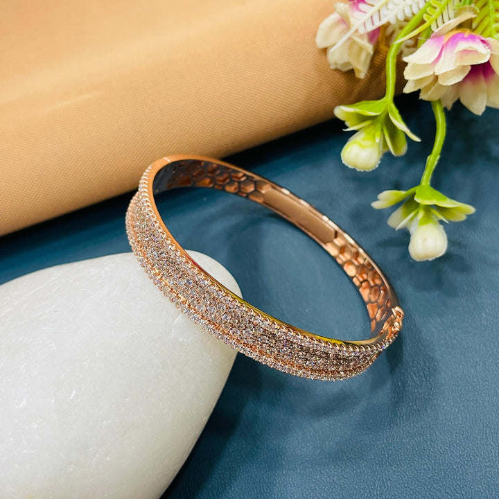 Fashionable rose gold bracelet with AD stones, perfect for layering.