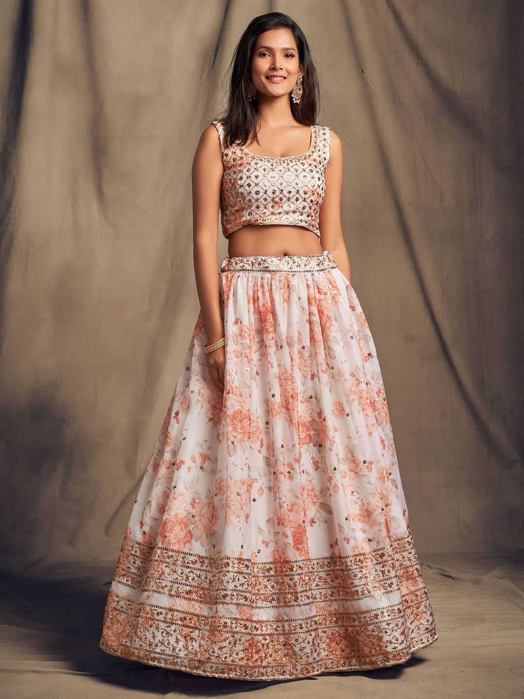 White organza lehenga dress with intricate floral print embroidery