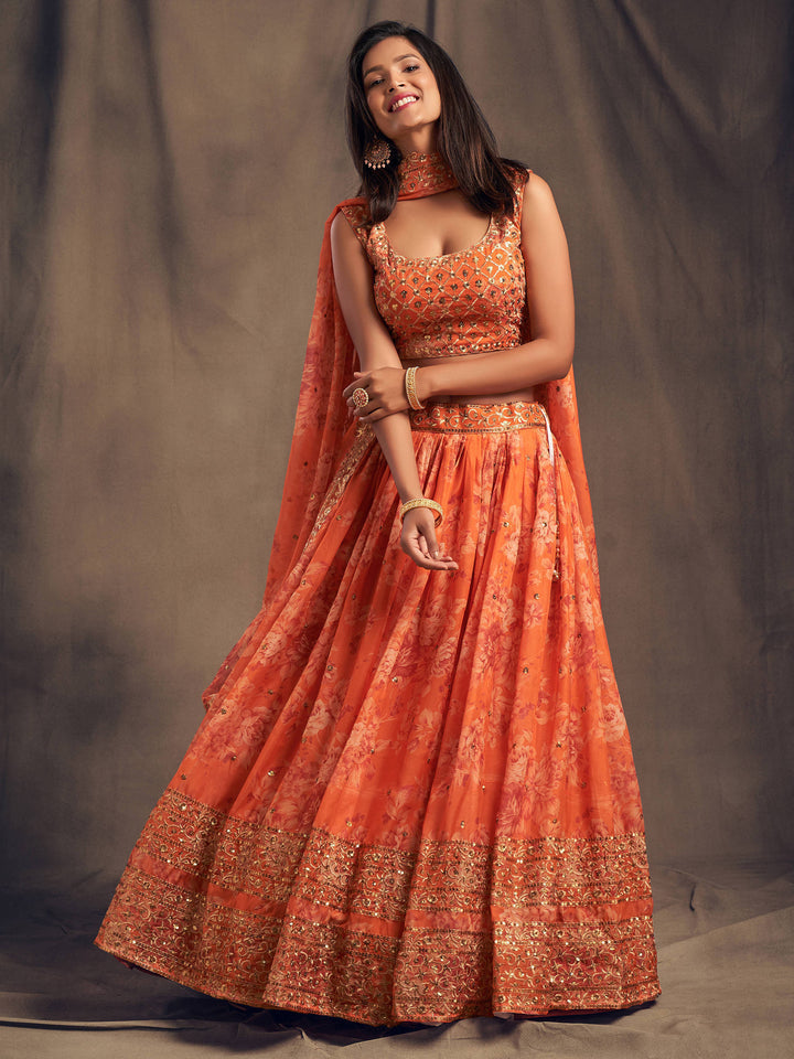 Orange floral printed organza lehenga with zari and sequin embroidery