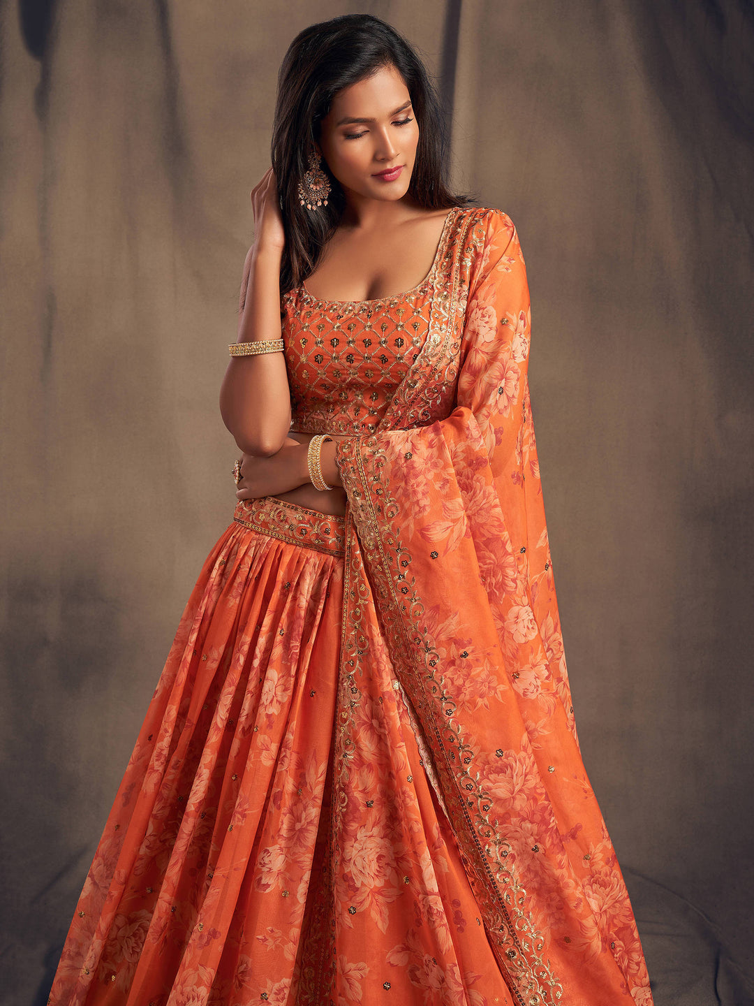 Traditional orange lehenga for weddings and festive occasions