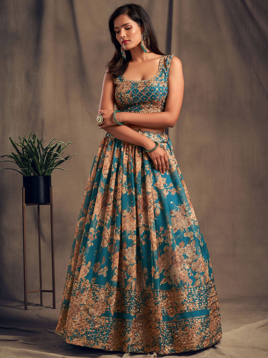 Semi-stitched teal blue lehenga choli with sequins and floral work