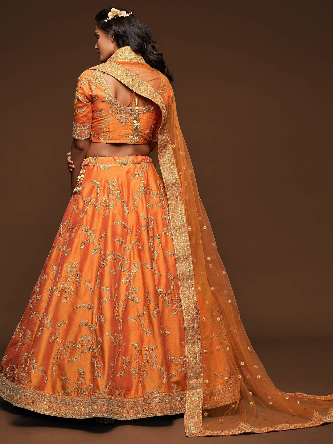 Semi-stitched orange crop top lehenga for weddings and engagements