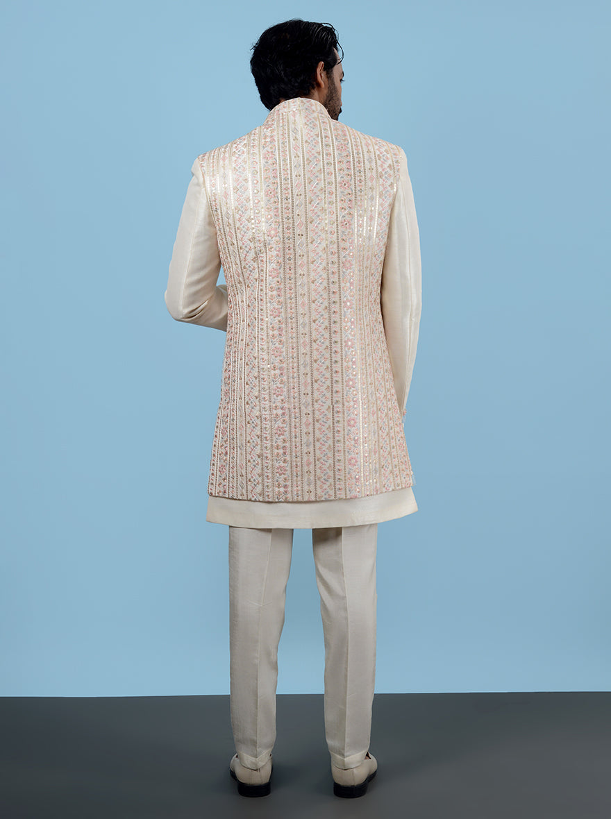 Make a statement at any celebration in the USA with this Cream Indowestern, featuring luxurious Silk Blend fabric and intricate Resham and sequins detailing for a touch of elegance.