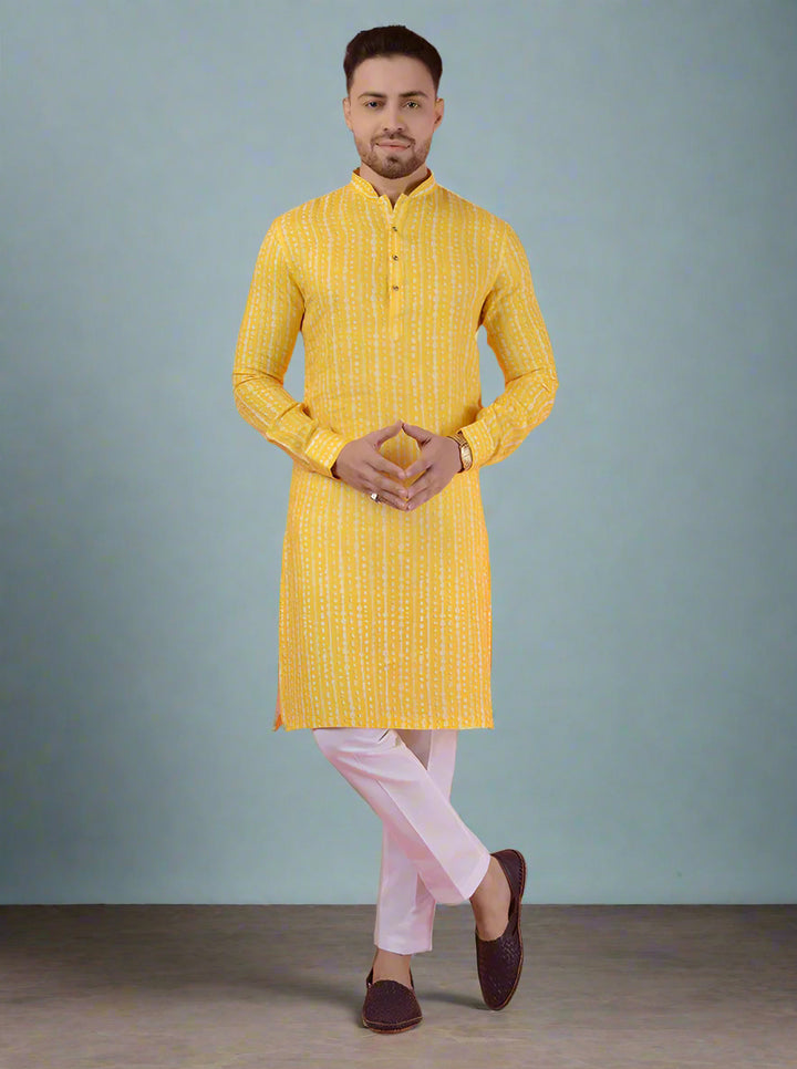 Stylish men's yellow linen kurta pajama with full sleeves and mandarin collar for ethnic occasions.