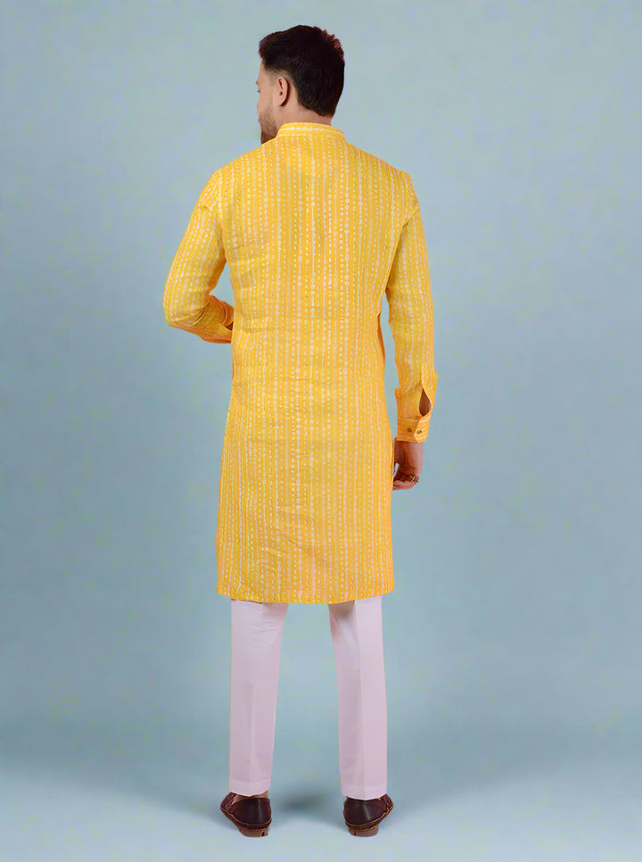 Men's yellow linen kurta pajama, crafted with full sleeves and mandarin collar for traditional wear.