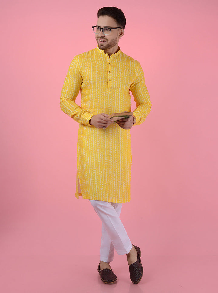 Traditional yellow kurta pajama for men with mandarin collar, crafted from linen for a stylish fit.