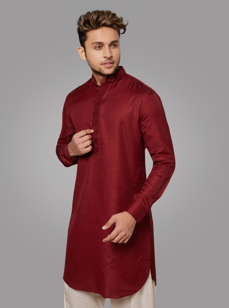 Step into sophistication with our ruby red kurta, designed for festive occasions.