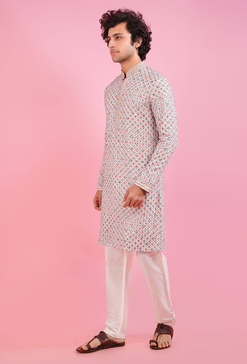 Men’s embroidered cream silk kurta pajama set, ideal for Diwali and cultural gatherings.