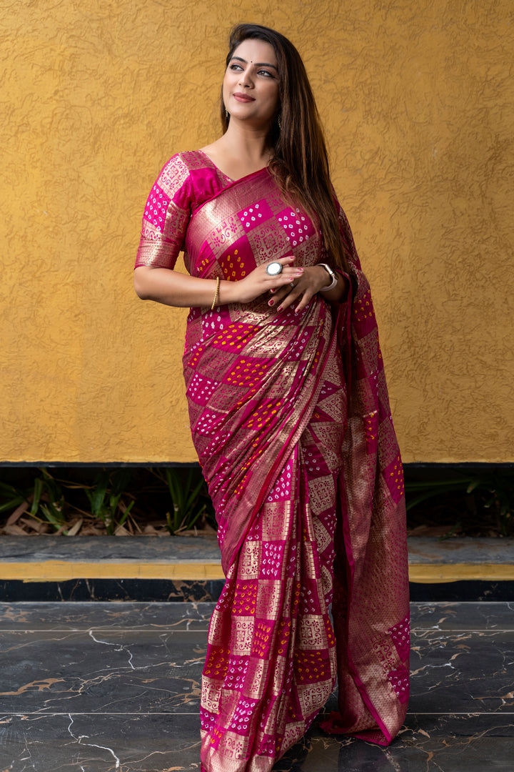 Rich blue Bandhej silk saree with intricate zari weaving and eye-catching drape, perfect for weddings and festivals.