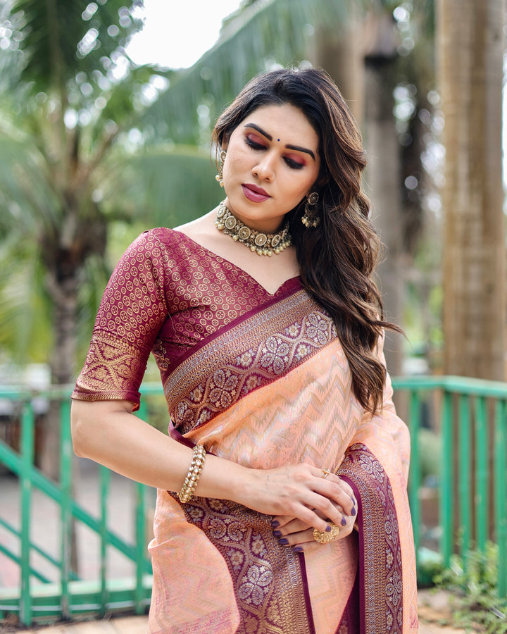 Elegant Peach Kanjivaram Pattu Saree featuring Leheriya design and luxurious heavy border.