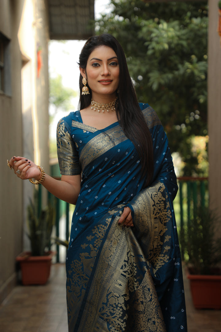 Teal Kanjivaram silk saree with intricate pallu and luxurious design, perfect for cultural celebrations.