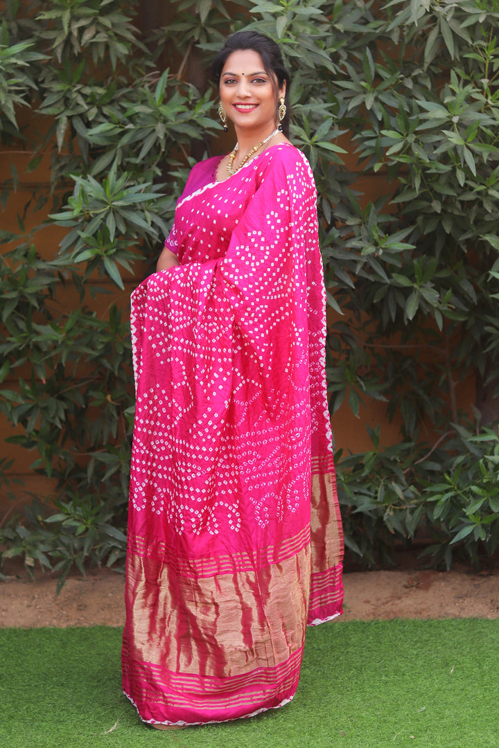 Elegant pink Bandhej silk saree with Lagdi Patta, showcasing intricate Zari pallu for festive gatherings."