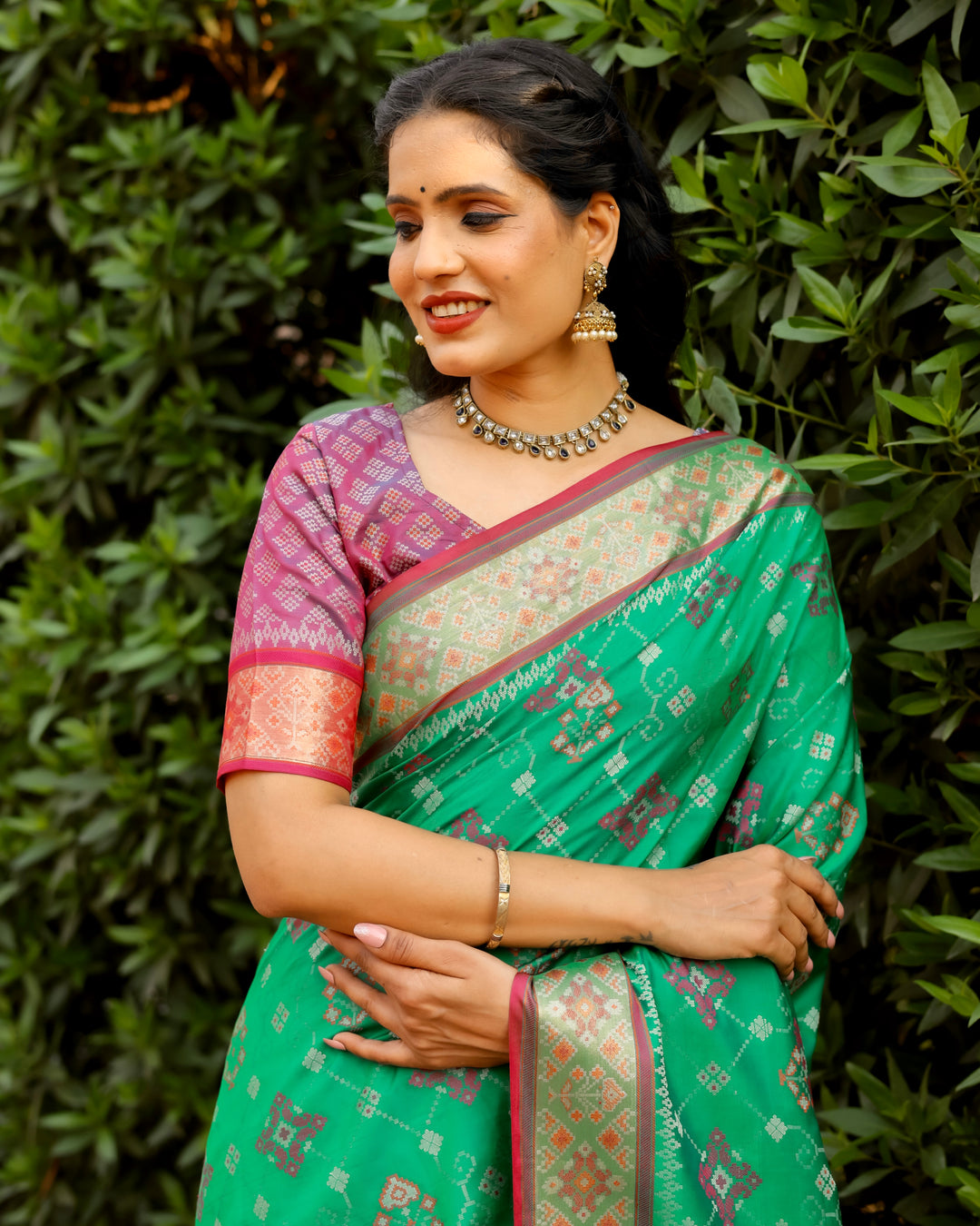 Celebrate in style with this mint green Ikkat Patola silk saree featuring delicate Ikkat patterns and Zari weaving borders.