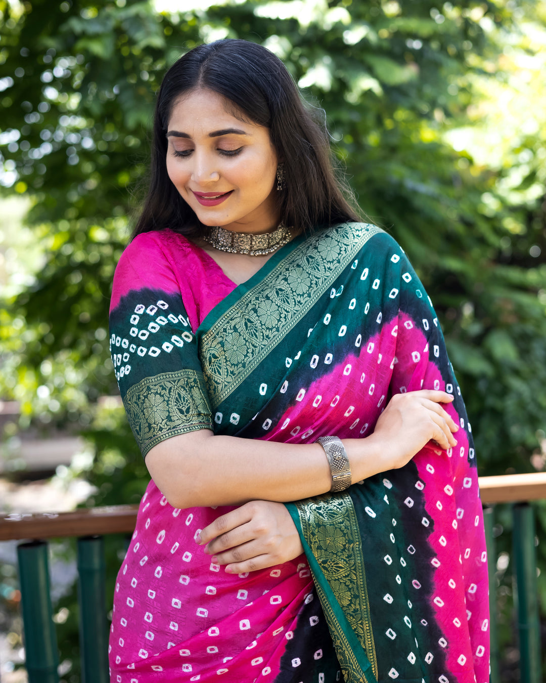 Gorgeous pink Bandhej silk saree with intricate zari work and matching blouse, ideal for weddings and celebrations.