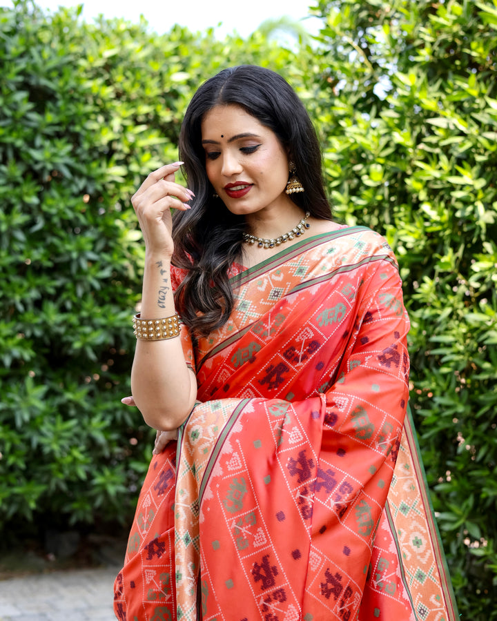 Vibrant orange Bandhej silk saree with zari woven pallu and matching blouse, ideal for weddings and celebrations.