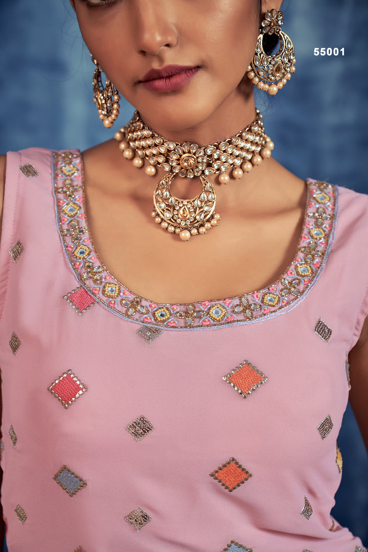 Gorgeous baby pink georgette sharara outfit with crystal stones and beads for weddings.