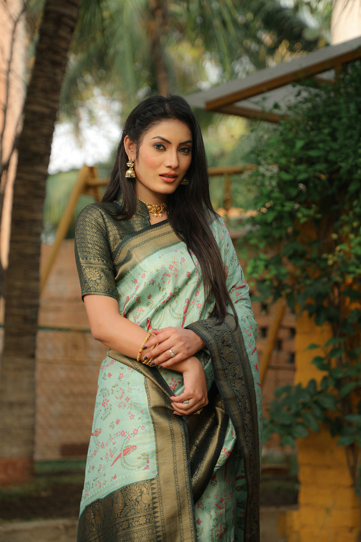 Traditional Mint green Indian saadi with detailed Kanjivaram weaving, perfect for weddings and cultural gatherings.