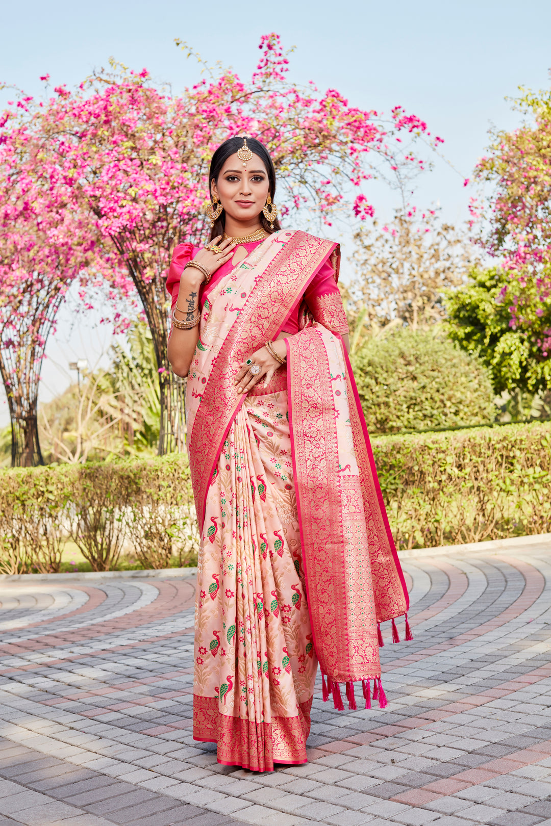 Elegant Baby Pink Soft Silk Saree with intricate Kanjivaram design for bridal celebrations.