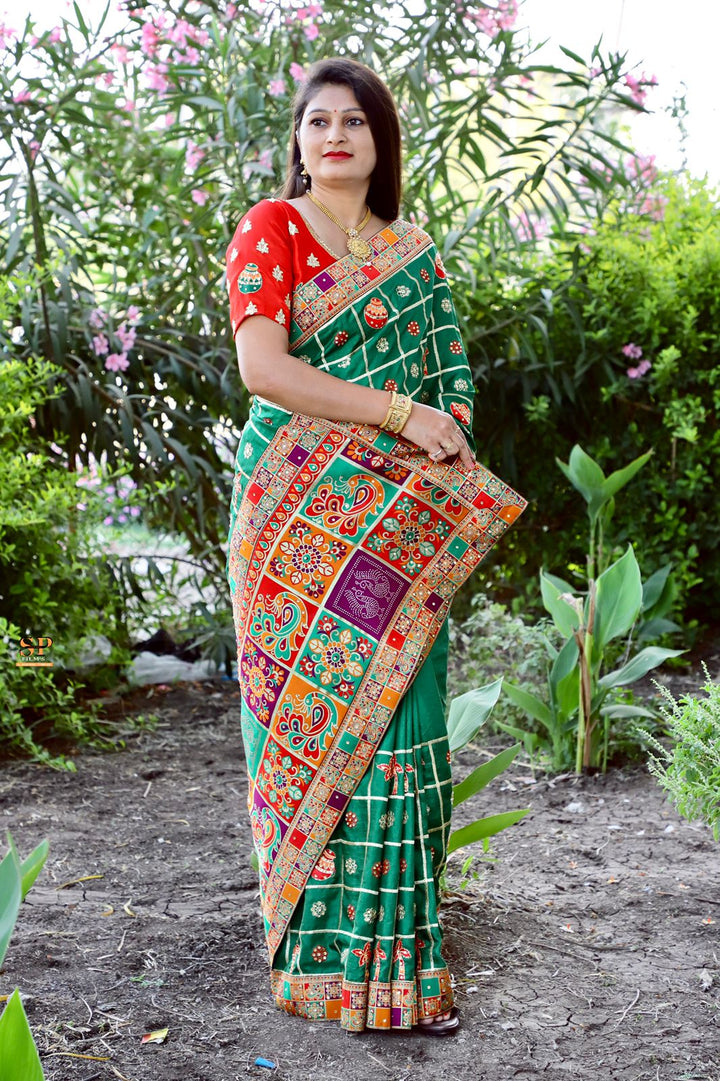 Dola Silk saree in red with detailed embroidery and diamond work, perfect for special occasions and festivals.