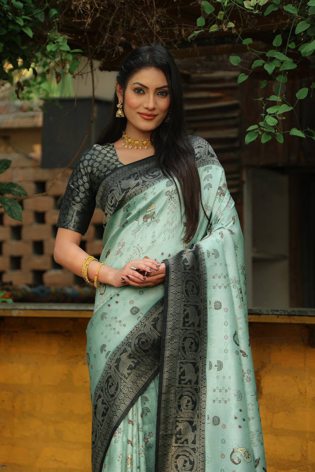 Classic white Kanjivaram silk saree with intricate weaving and traditional borders, ideal for festive events.