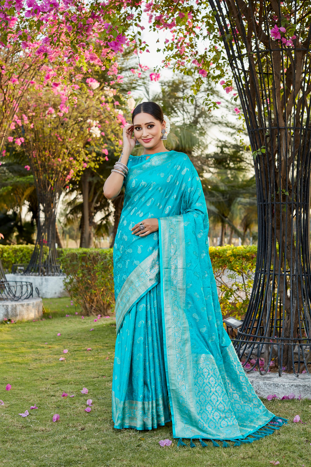 Radiant sky-blue satin silk Kanjivaram saree with delicate butta work and woven pallu, ideal for festive celebrations.