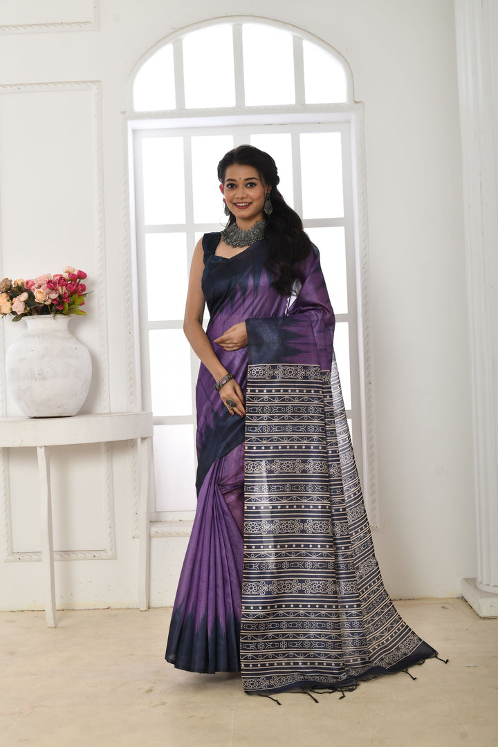 Traditional Tussar silk saree with a printed temple border and fabric pattern, complete with matching blouse piece.