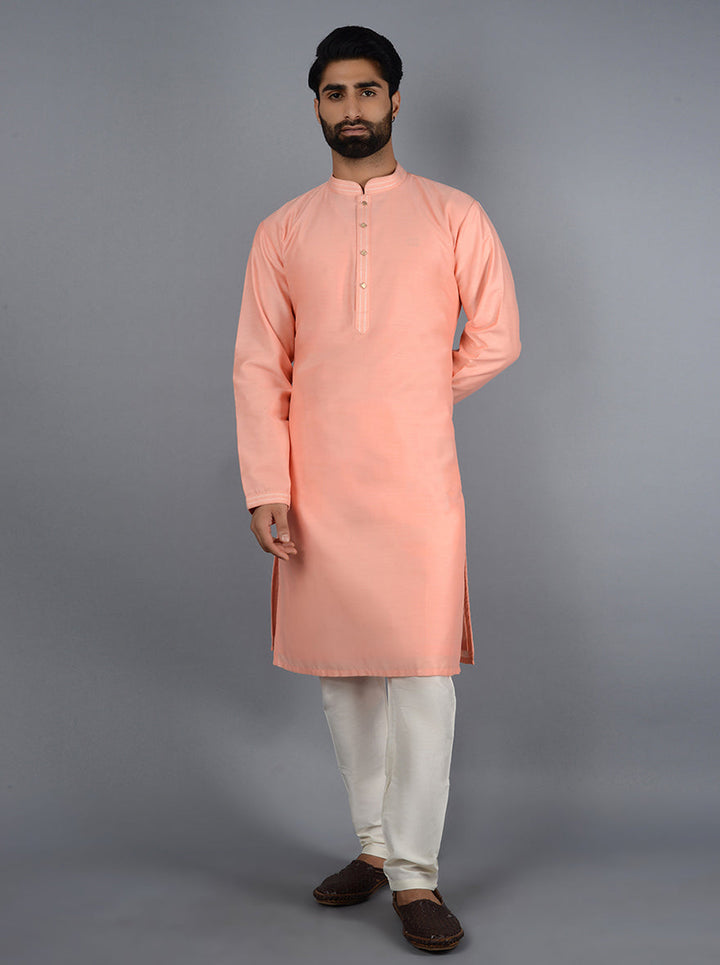 Peach embroidered kurta pajama for special occasions.