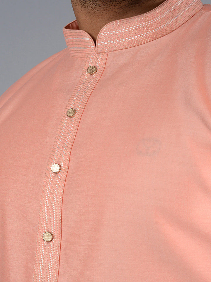 Unique peach kurta pajama combining tradition and modern style.