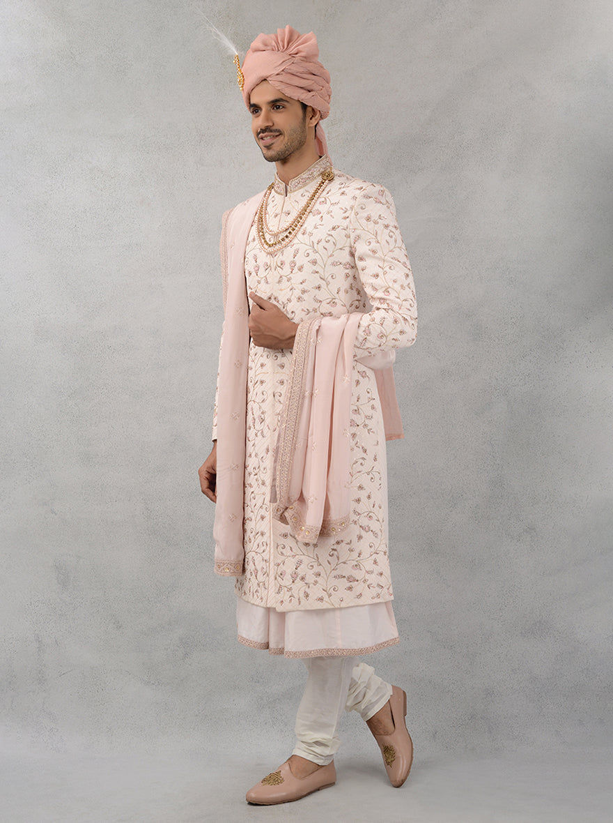 Ideal for weddings in the USA, this elegant fawn pink sherwani combines luxurious silk blend fabric with intricate designs to elevate your wedding attire.