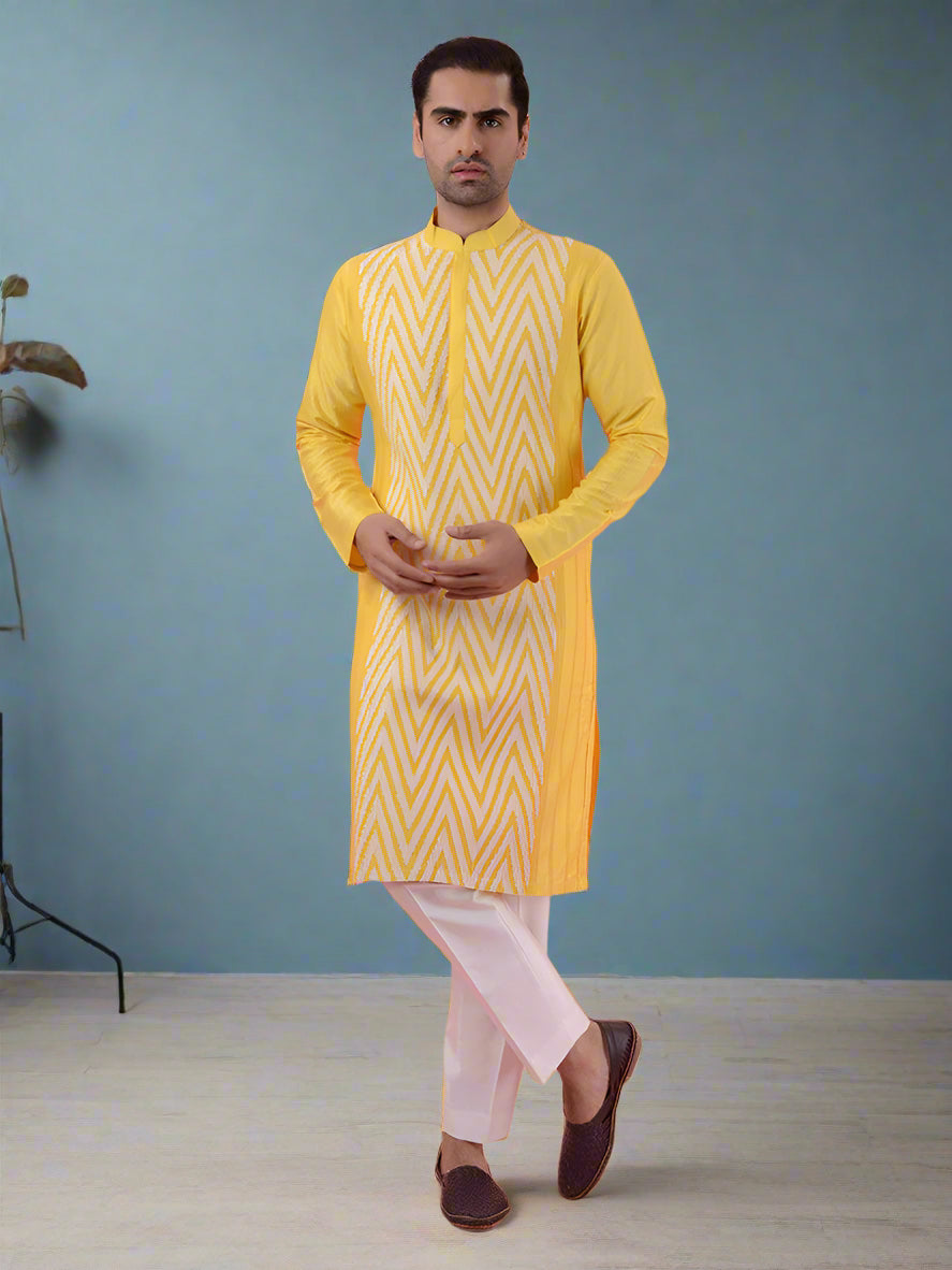 Traditional yellow silk kurta pajama set for men, perfect for weddings and festivals.