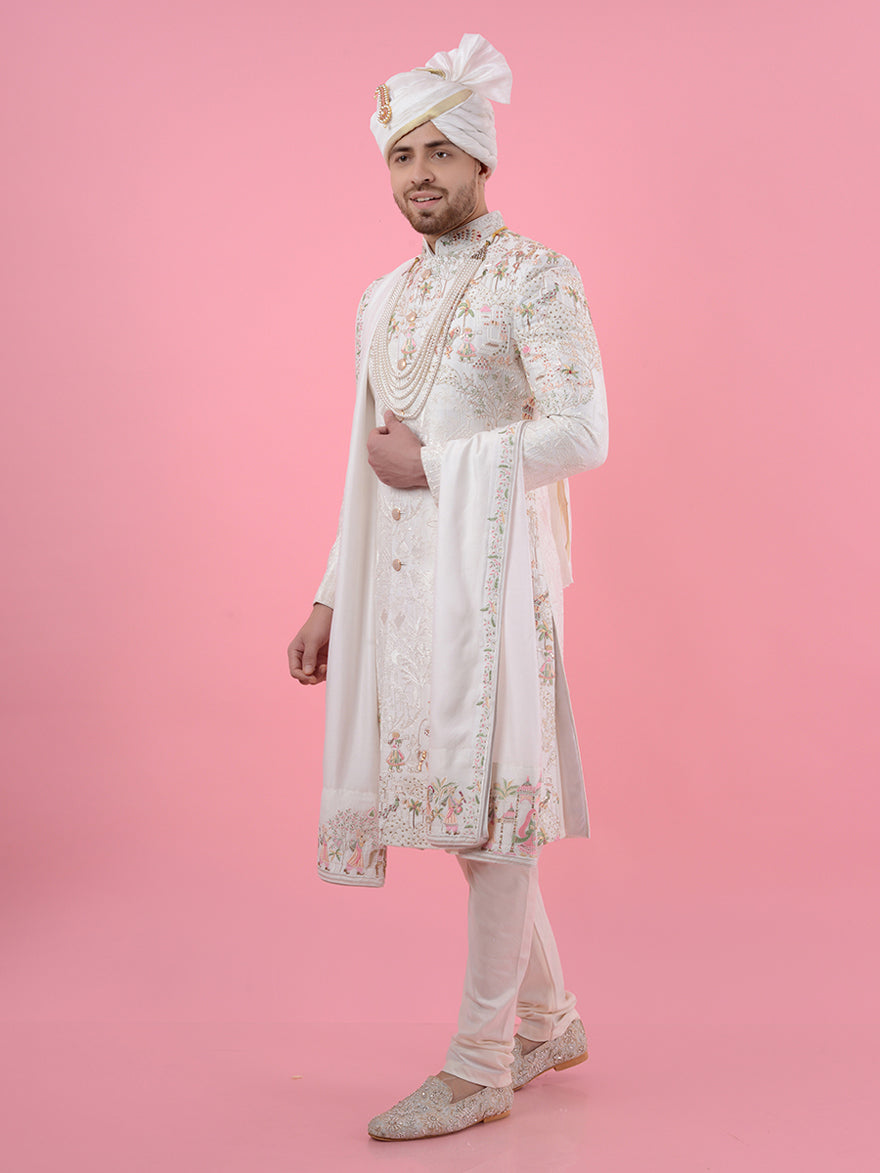 This Cream Silk Blend Sherwani features exquisite embroidery and is designed to create a memorable look for weddings in the USA, combining traditional charm with contemporary elegance.