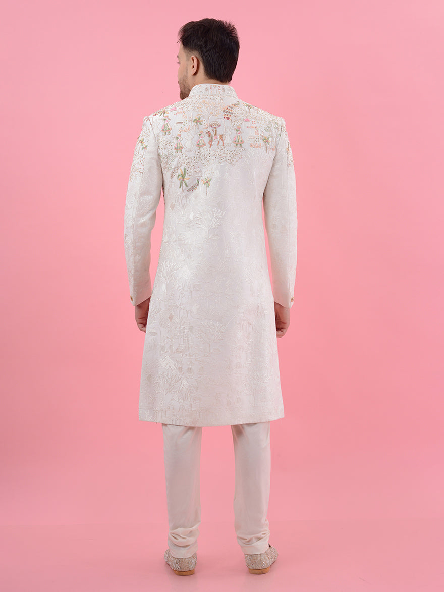 Experience the perfect fusion of traditional and modern styles with this Cream Silk Blend Sherwani, adorned with luxurious embroidery, ideal for making an impact at weddings in the USA.