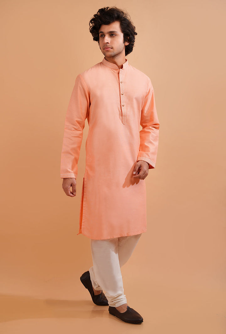 Men’s peach kurta pajama set, designed for comfortable yet stylish festive wear.