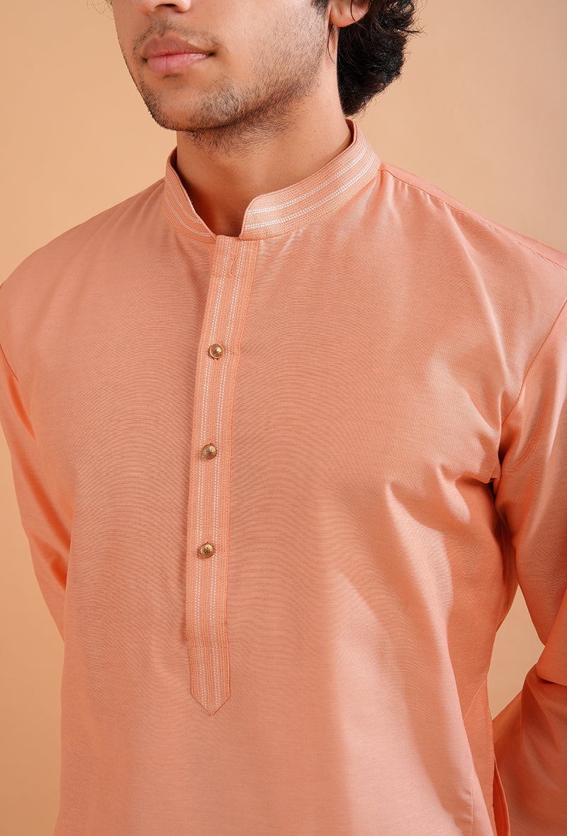 Sophisticated peach silk kurta pajama for USA men’s wardrobe essentials.