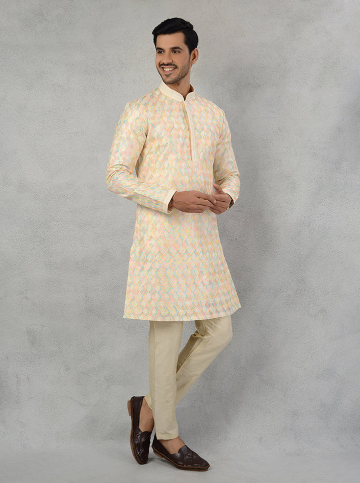 Resham work detailed cream silk blend kurta pajama for Haldi and Mehndi events.