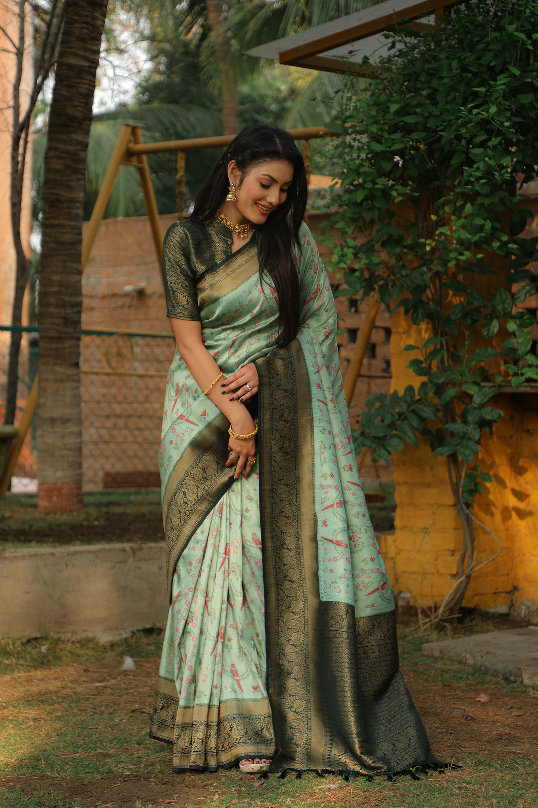 Gorgeous Mint green Indian sari made from pure Kanjivaram silk, adorned with woven borders for a sophisticated look.