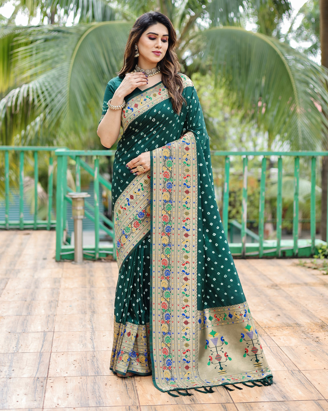 Traditional Paithani Bandhej silk sadi with rich colors like red, black, and blue.