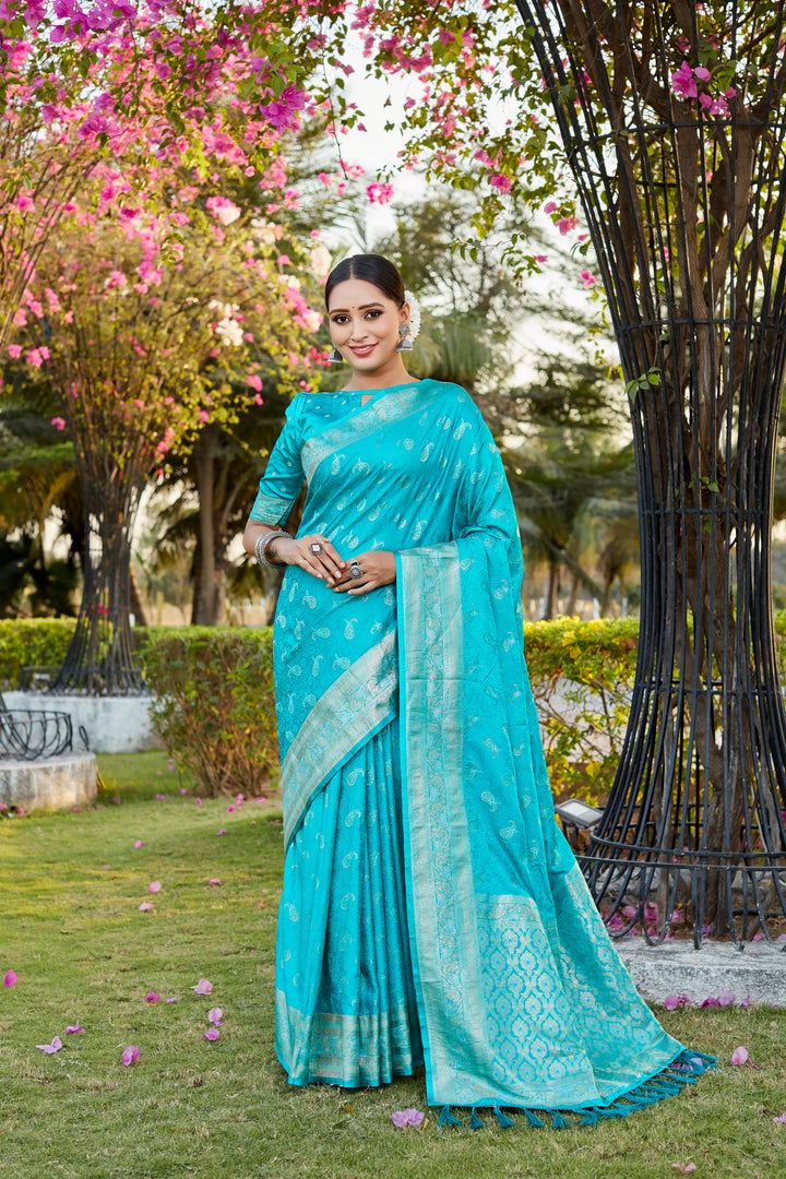 Elegant sky-blue Kanjivaram saree with intricate butta design and woven pallu, perfect for a grand occasion.