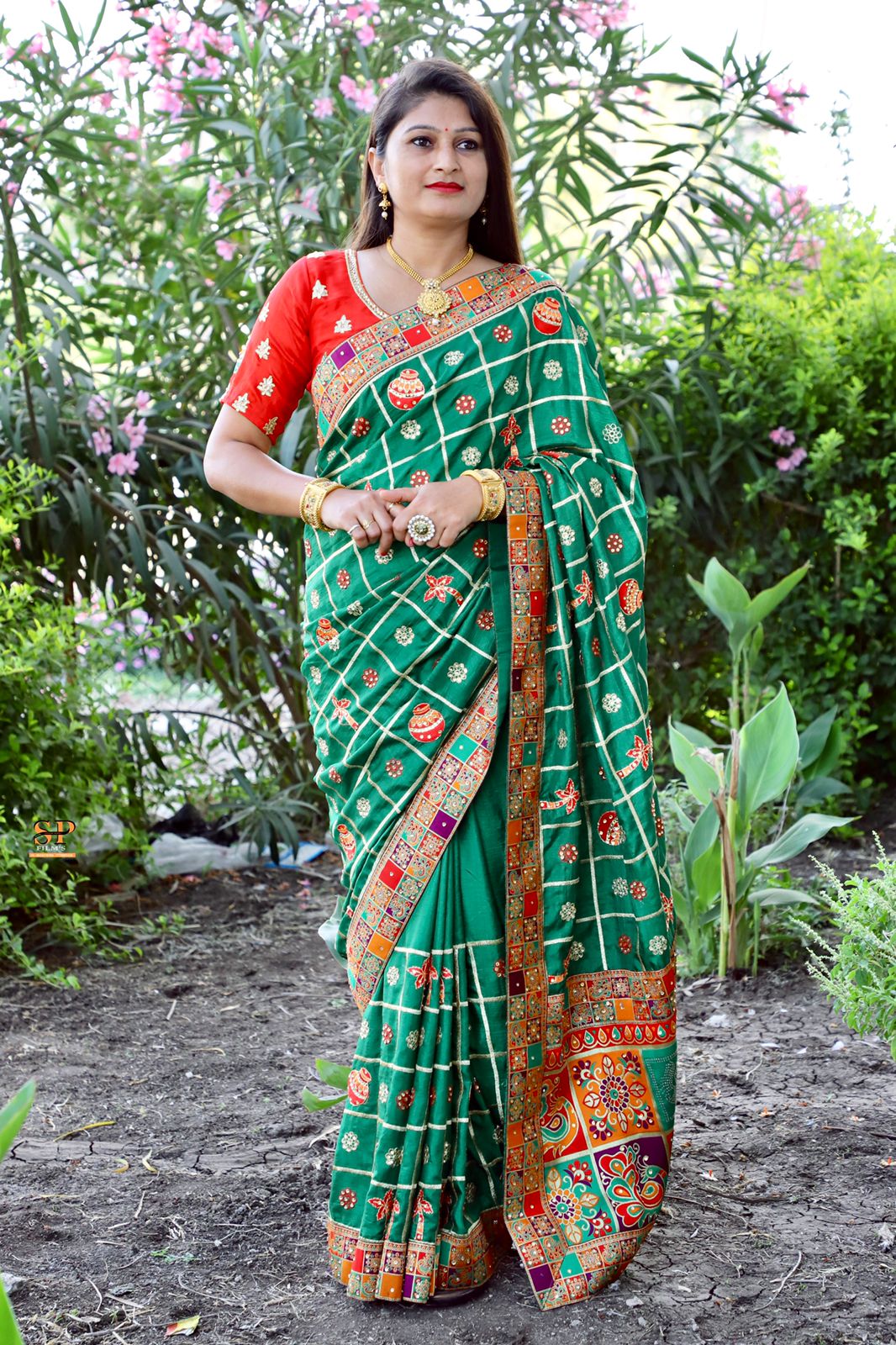 Red Dola Silk saree with jacquard lace border and fine embroidery, offering a blend of tradition and elegance.