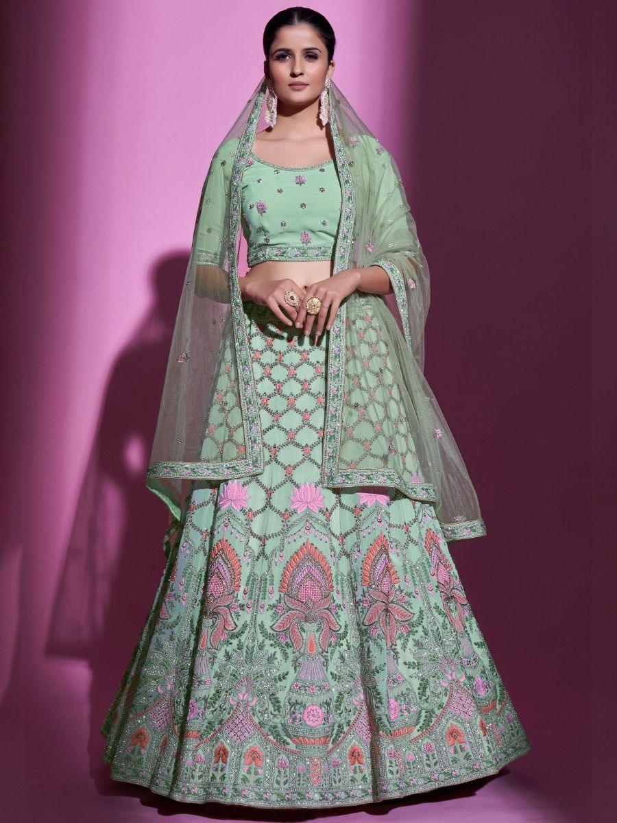 Semi-stitched pista green wedding lehenga choli with lace dupatta.