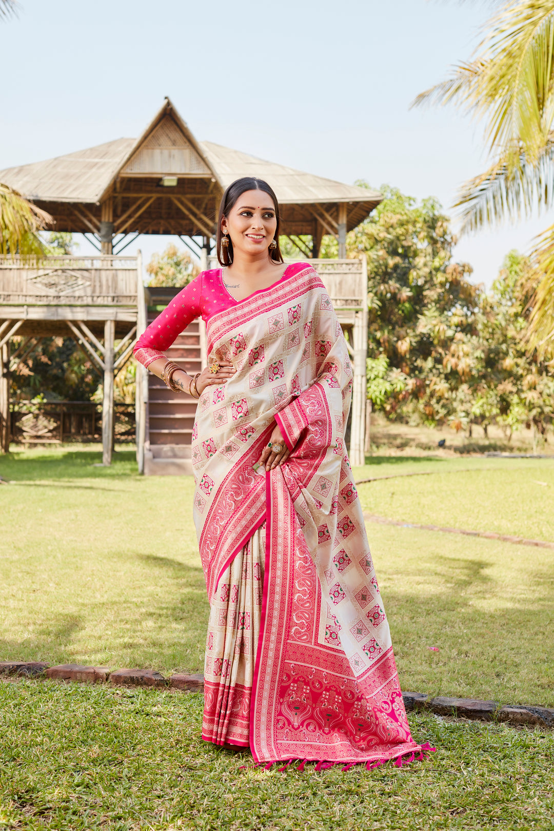 Traditional pink Kanjivaram soft silk saree with intricate work and sophisticated designer borders.