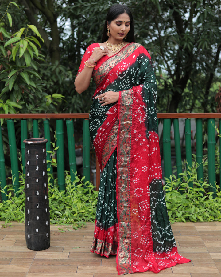 Elegant teal-green Bandhej Tapeta silk saree with intricate Bandhej pattern and dual-color contrast.