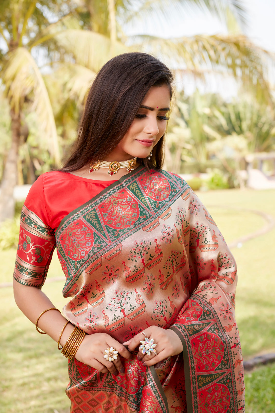 Gorgeous red Kanjivaram silk saree with a rich pallu and intricate embroidery, perfect for making a grand entrance.