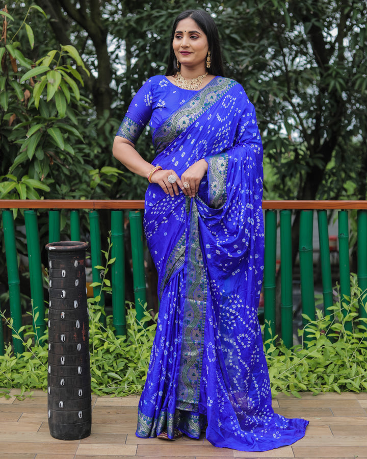 Elegant blue Bandhej silk sadi with intricate Bandhej tie-dye design and bold broad border.